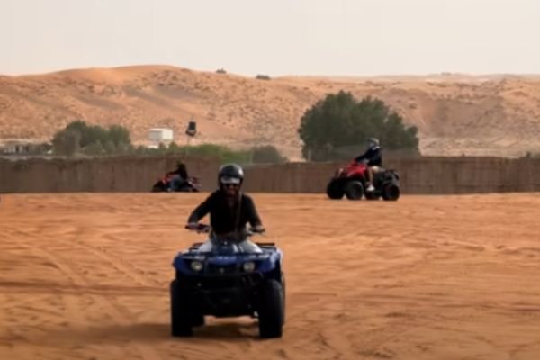 Tourists enjoying a dune buggy ride